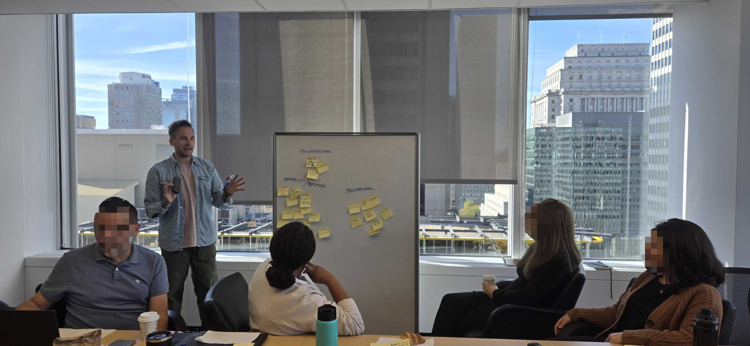 Shawn standing at a whiteboard facilitating a workshop with Fairstone agent managers
